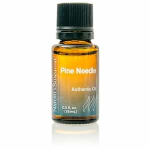 Pine Needle Essential Oil bottle with fresh pine needles, symbolizing respiratory support, clarity, and forest-fresh natural cleansing.