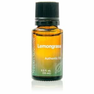 Bottle of Lemongrass Essential Oil with fresh lemongrass, showcasing pure and authentic aromatherapy benefits.